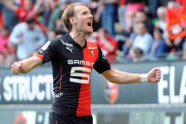 Rennes' forward Ola Toivonen (R) celebrates after scoring during the French L1 football match between Rennes and Guingamp on April 12, 2015 at the Route de Lorient stadium in Rennes, western France. AFP PHOTO / THOMAS BREGARDIS        (Photo credit should read THOMAS BREGARDIS/AFP/Getty Images)