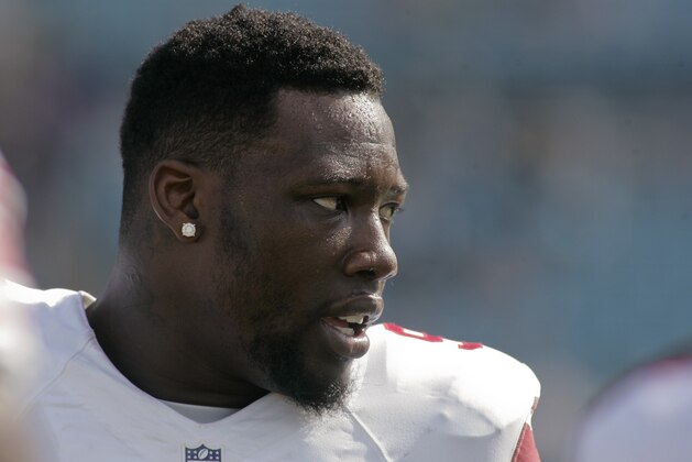 Nov 30, 2014; Jacksonville, FL, USA; New York Giants defensive end Jason Pierre-Paul (90) looks on prior to the game against the Jacksonville Jaguars at EverBank Field. Mandatory Credit: Phil Sears-USA TODAY Sports