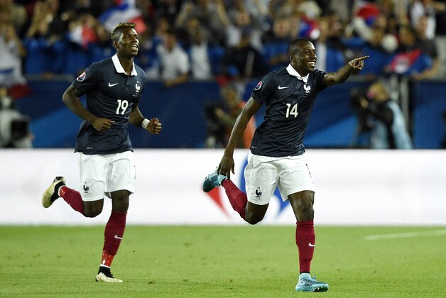 France's midfielder Blaise Matuidi (R) celebrates after scoring during the Euro 2016 friendly football match France vs Serbia at the Matmut Atlantique stadium in Bordeaux on September 7, 2015.   AFP PHOTO/ FRANCK FIFE        (Photo credit should read FRANCK FIFE/AFP/Getty Images)