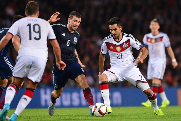 GLASGOW, SCOTLAND - SEPTEMBER 7 : Ilkay Gundogan of Germany takes on James McAurthur of Scotland during the EURO 2016 Qualifier between Scotland and Germany at Hamden Park on September 7, 2015 in Glasgow, Scotland. (Photo by Mark Runnacles/Getty Images)