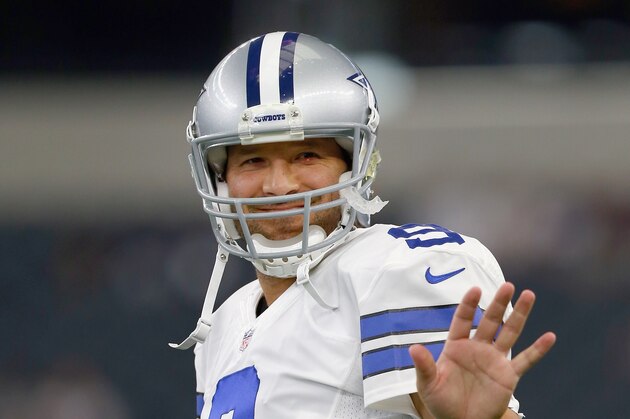 ARLINGTON, TX - AUGUST 29:  Tony Romo #9 of the Dallas Cowboys waves to his son on the sidelines before the Cowboys take on the Minnesota Vikings on August 29, 2015 in Arlington, Texas.  (Photo by Tom Pennington/Getty Images)