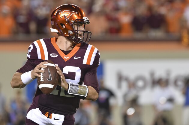 BLACKSBURG, VA - SEPTEMBER 7:  Quarterback Michael Brewer #12 of the Virginia Tech Hokies looks to pass against the Ohio State Buckeyes in the first half at Lane Stadium on September 7, 2015 in Blacksburg, Virginia. (Photo by Michael Shroyer/Getty Images)