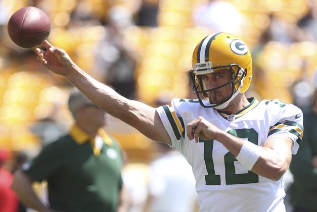 Aug 23, 2015; Pittsburgh, PA, USA; Green Bay Packers quarterback Aaron Rodgers (12) warms up on the field before playing the Pittsburgh Steelers at Heinz Field. Mandatory Credit: Charles LeClaire-USA TODAY Sports