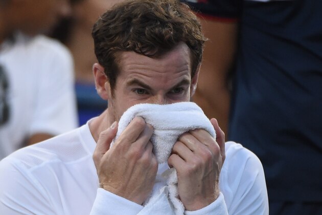Andy Murray of the UK holds a towel between games against Kevin Anderson of South Africa during their 2015 US Open men's singles round- four match at the USTA Billie Jean King National Tennis Center September 7, 2015  in New York.        AFP PHOTO /  TIMOTHY  A. CLARY        (Photo credit should read TIMOTHY A. CLARY/AFP/Getty Images)