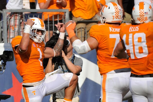 NASHVILLE, TN - SEPTEMBER 05:  Kyler Kerbyson #77 and Alex Ellis #48 of the University of Tennessee Volunteers congratulate teammate Jalen Hurd #1 on scoring a touchdown against the Bowling Green Falcons during the first half at Nissan Stadium on September 5, 2015 in Nashville, Tennessee.  (Photo by Frederick Breedon/Getty Images)