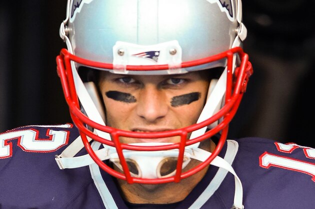 Aug 28, 2015; Charlotte, NC, USA; New England Patriots quarterback Tom Brady (12) emerges from the tunnel during pre game warm ups at Bank of America Stadium. Mandatory Credit: Jim Dedmon-USA TODAY Sports