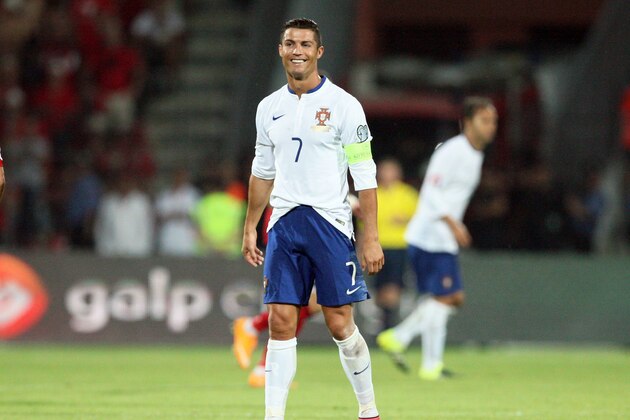 Portugal's Cristiano Ronaldo smiles during the Euro 2016 qualifying football match between Albania and Portugal at the Elbasan Arena in Elbasan on September 7, 2015. Portugal defeated Albania 1-0. AFP PHOTO / GENT SHKULLAKU        (Photo credit should read GENT SHKULLAKU/AFP/Getty Images)