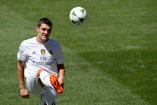 Real Madrid's new player Croatian Mateo Kovacic kicks the ball as he poses during his official presentation at the Santiago Bernabeu stadium in Madrid on August 19, 2015.  AFP PHOTO / DANI POZO        (Photo credit should read DANI POZO/AFP/Getty Images)