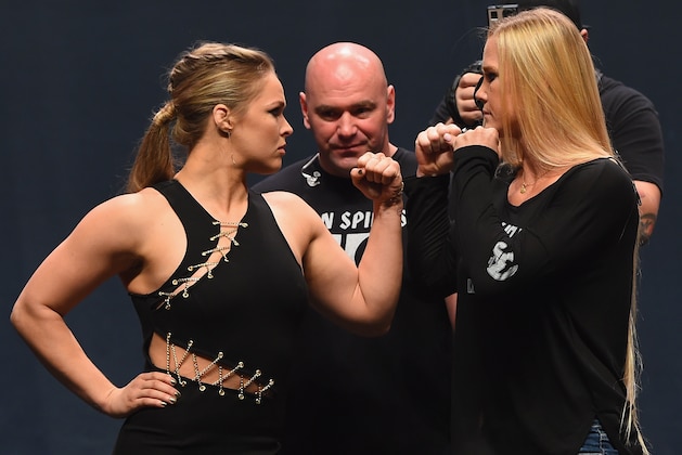 LAS VEGAS, NV - SEPTEMBER 04:  (L-R) UFC women's bantamweight champion Ronda Rousey and Holly Holm face off during the UFC's Go Big launch event inside MGM Grand Garden Arena on September 4, 2015 in Las Vegas, Nevada.  (Photo by Josh Hedges/Zuffa LLC/Zuffa LLC via Getty Images)