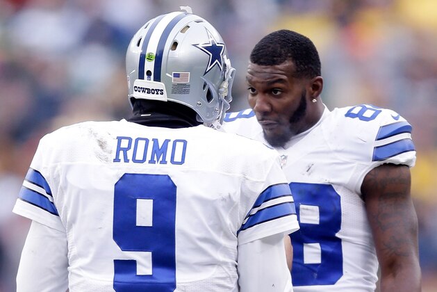 GREEN BAY, WI - JANUARY 11:  Quarterback  Tony Romo #9 and  Dez Bryant #88 of the Dallas Cowboys wait for the call on an instant replay during the 2015 NFC Divisional Playoff game against the Green Bay Packers at Lambeau Field on January 11, 2015 in Green Bay, Wisconsin.  (Photo by Mike McGinnis/Getty Images)