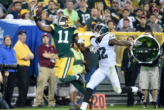 Aug 29, 2015; Green Bay, WI, USA;  Green Bay Packers wide receiver Larry Pinkard (11) can't hold on to a pass while defended by Philadelphia Eagles cornerback Eric Rowe (32) in the fourth quarter at Lambeau Field. Mandatory Credit: Benny Sieu-USA TODAY Sports
