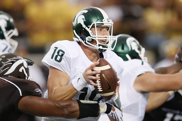 KALAMAZOO, MI - SEPTEMBER 4: Connor Cook #18 of the Michigan State Spartans is pressured by Nathan Braster #53 of the Western Michigan Broncos in the first half at Waldo Stadium on September 4, 2015 in Kalamazoo, Michigan. (Photo by Joe Robbins/Getty Images)