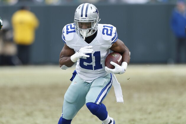 GREEN BAY, WI - JANUARY 11: Joseph Randle #21 of the Dallas Cowboys runs with the ball against the Green Bay Packers during the NFC Divisional Playoff game at Lambeau Field on January 11, 2015 in Green Bay, Wisconsin. The Packers defeated the Cowboys 26-21. (Photo by Joe Robbins/Getty Images)