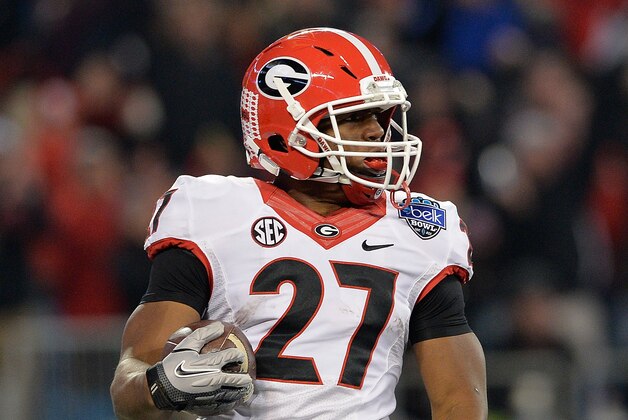 CHARLOTTE, NC - DECEMBER 30:  Nick Chubb #27 of the Georgia Bulldogs runs against the Louisville Cardinals during the Belk Bowl at Bank of America Stadium on December 30, 2014 in Charlotte, North Carolina. Georgia won 37-14.  (Photo by Grant Halverson/Getty Images)