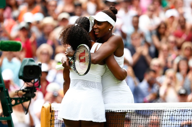 LONDON, ENGLAND - JULY 06:  Serena Williams of the United States hugs Venus Williams of the United States after their Ladies' Singles Fourth Round match  during day seven of the Wimbledon Lawn Tennis Championships at the All England Lawn Tennis and Croquet Club on July 6, 2015 in London, England.  (Photo by Julian Finney/Getty Images)