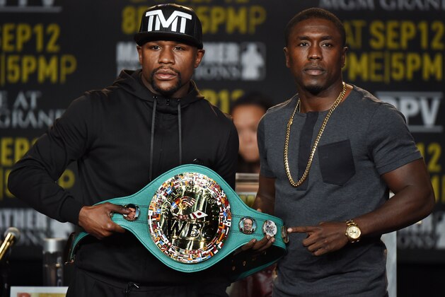 Boxers Floyd 'Money' Mayweather (L) and Andre Berto (R) face off during a press conference to officially announce their September 12 fight that will place at the MGM Grand Garden Arena in Las Vegas, at the Marriott Hotel in Los Angeles, California on August 6, 2015.  Mayweather claims it will be the last ever opportunity to see him fight.          AFP PHOTO / MARK RALSTON        (Photo credit should read MARK RALSTON/AFP/Getty Images)