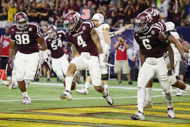HOUSTON, TX - SEPTEMBER 05:  Noel Ellis #4 of the Texas A&M Aggies celebates after a fumble recoverry in the second half of their game against the Arizona State Sun Devils during the Advocare Texas Kickoff at NRG Stadium on September 5, 2015 in Houston, Texas.  (Photo by Scott Halleran/Getty Images)