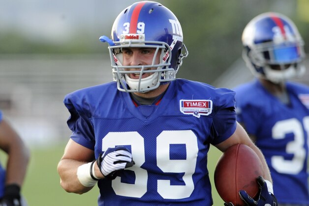 New York Giants safety Tyler Sash runs back an interception during NFL football training camp Friday, Aug. 5, 2011 in East Rutherford, N.J. (AP Photo/Bill Kostroun)