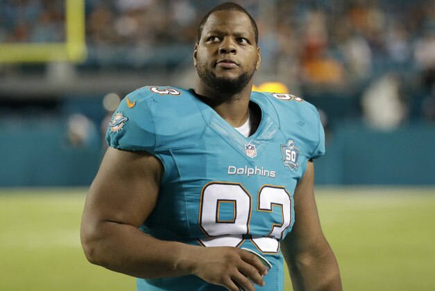 Miami Dolphins defensive tackle Ndamukong Suh (93) walks back to the sidelines during the second half of an NFL preseason football game against the Atlanta Falcons, Saturday, Aug. 29, 2015 in Miami Gardens, Fla. The Dolphins defeated the Falcons 13-9. (AP Photo/Wilfredo Lee)