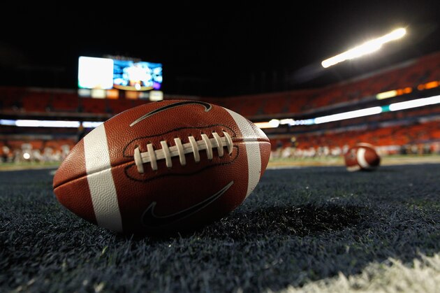 MIAMI GARDENS, FL - JANUARY 04:  A detail of a Nike official NCAA size football as it sits in the end zone while the West Virginia Mountaineers stretchon the field prior to playing against the Clemson Tigers during the Discover Orange Bowl at Sun Life Stadium on January 4, 2012 in Miami Gardens, Florida.  (Photo by Streeter Lecka/Getty Images)