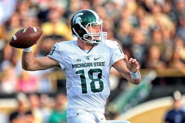 Sep 4, 2015; Kalamazoo, MI, USA; Michigan State Spartans quarterback Connor Cook (18) attempts to throw the ball against the Western Michigan Broncos prior to a game at Waldo Stadium. Mandatory Credit: Mike Carter-USA TODAY Sports
