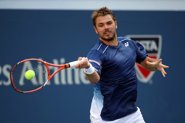 NEW YORK, NY - SEPTEMBER 07:  Stan Wawrinka of Switzerland returns a shot to Donald Young of the United States during their Men's Singles Fourth Round match on Day Eight of the 2015 US Open at the USTA Billie Jean King National Tennis Center on September 7, 2015 in the Flushing neighborhood of the Queens borough of New York City.  (Photo by Streeter Lecka/Getty Images)