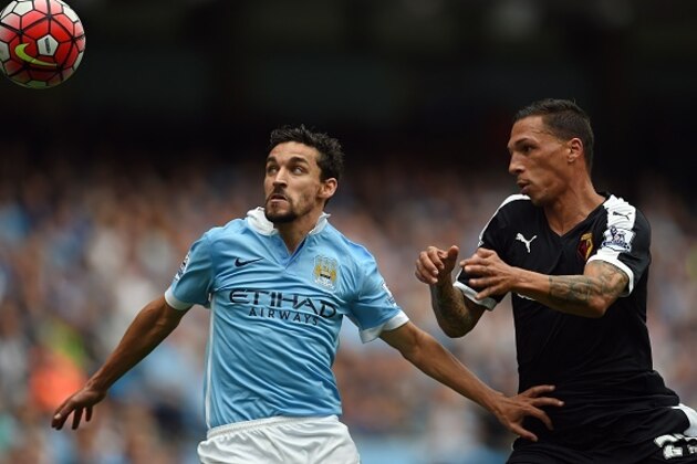 Manchester City's Spanish midfielder Jesus Navas (L) is challenged by Watford's German-born Greek midfielder José Holebas during the English Premier League football match between Manchester City and Watford at The Etihad Stadium in Manchester, north west England on August 29, 2015. AFP PHOTO / PAUL ELLIS

RESTRICTED TO EDITORIAL USE. No use with unauthorized audio, video, data, fixture lists, club/league logos or 'live' services. Online in-match use limited to 75 images, no video emulation. No use in betting, games or single club/league/player publications.        (Photo credit should read PAUL ELLIS/AFP/Getty Images)