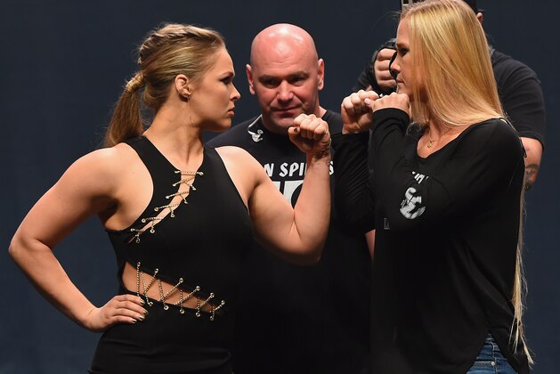 LAS VEGAS, NV - SEPTEMBER 04:  (L-R) UFC women's bantamweight champion Ronda Rousey and Holly Holm face off during the UFC's Go Big launch event inside MGM Grand Garden Arena on September 4, 2015 in Las Vegas, Nevada.  (Photo by Josh Hedges/Zuffa LLC/Zuffa LLC via Getty Images)