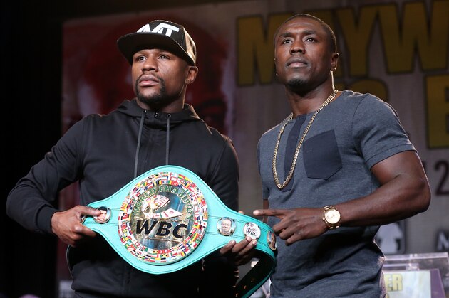 LOS ANGELES, CA - AUGUST 06:  Floyd Mayweather (L) and Andre Berto pose with Mayweather's belt at a press conference ahead of the upcoming fight at JW Marriott Los Angeles at L.A. LIVE on August 6, 2015 in Los Angeles, California.  (Photo by Stephen Dunn/Getty Images)