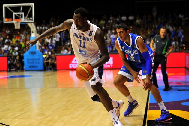 Philippines' centre Andray Blatche (L) vies with Greece's centre Giannis Bourousis during the 2014 FIBA World basketball championships group B match Philippines vs Greece at the Palacio Municipal de Deportes in Sevilla on August 31, 2014.  AFP PHOTO/ CRISTINA QUICLER        (Photo credit should read CRISTINA QUICLER/AFP/Getty Images)