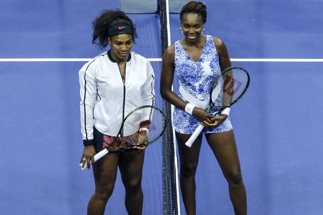 Venus Williams ( R ) and Serena Williams ( L) pose for a picture before their 2015 US Open Women's Singles Quarterfinals match at the USTA Billie Jean King National Tennis Center September 8, 2015 in New York. AFP PHOTO/KENA BETANCUR        (Photo credit should read KENA BETANCUR/AFP/Getty Images)