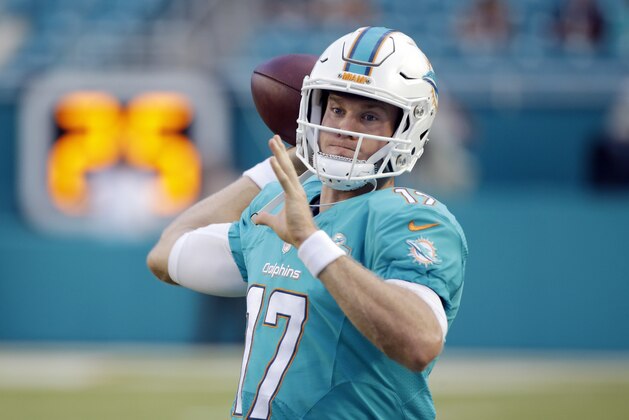 Miami Dolphins quarterback Ryan Tannehill (17) warms up before an NFL preseason football game against the Tampa Bay Buccaneers, Thursday, Sept. 3, 2015 in Miami Gardens, Fla.  (AP Photo/Wilfredo Lee)