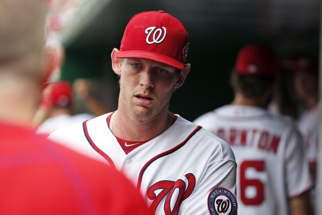 Washington Nationals starting pitcher Stephen Strasburg walks in the dugout before a baseball game against the Miami Marlins at Nationals Park, Sunday, Aug. 30, 2015, in Washington. (AP Photo/Alex Brandon)