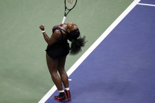 Serena Williams reacts after beating Venus Williams during a quarterfinal match at the U.S. Open tennis tournament, Tuesday, Sept. 8, 2015, in New York. (AP Photo/Jason DeCrow)