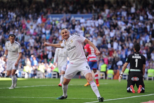MADRID, SPAIN - APRIL 05:  Karim Benzema of Real Madrid CF celebrates after scoring his team's 7th goal during the La Liga match between Real Madrid CF and Granada CF at Estadio Santiago Bernabeu on April 5, 2015 in Madrid, Spain.  (Photo by Denis Doyle/Getty Images)
