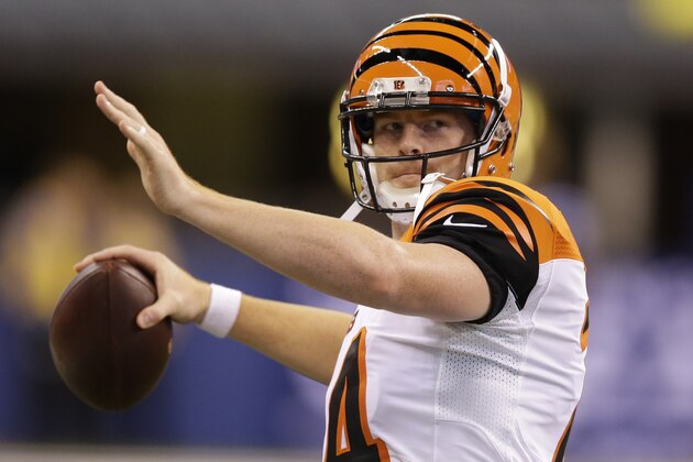 Cincinnati Bengals' Andy Dalton (14) throws before the start of an NFL preseason football game Thursday, Sept. 3, 2015 in Indianapolis. (AP Photo/Michael Conroy)