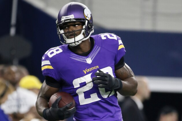 Minnesota Vikings running back Adrian Peterson (28) runs with the ball during warm ups before a preseason NFL football game against the Dallas Cowboys Saturday, Aug. 29, 2015, in Arlington, Texas.  (AP Photo/Tony Gutierrez)