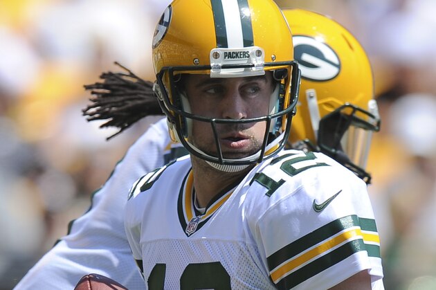 Green Bay Packers quarterback Aaron Rodgers (12) plays in the NFL preseason football game between the Pittsburgh Steelers and the Green Bay Packers, Sunday, Aug. 23, 2015 in Pittsburgh. (AP Photo/Don Wright)