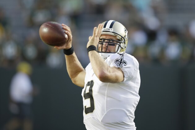 New Orleans Saints quarterback Drew Brees warms up before a preseason NFL football game against the Green Bay Packers Thursday, Sept. 3, 2015, in Green Bay, Wis. (AP Photo/Jeffrey Phelps)