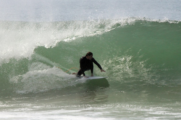 Big waves challenge surfers at Malibu, Calif., as a long-period, south swell moved into the Southern California Bight on Sunday, May 3, 2015. The National Weather Service said the swell, with a period of about 20 seconds, would translate to surf of 5 feet to 8 feet with local sets to 10 feet at favored south-facing beaches including Malibu. Beachgoers were warned to expect powerful rip currents. (AP Photo/John Antczak)
