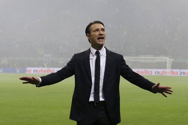 Croatia coach Niko Kovac talks with Croatia supporters during the Euro 2016 qualifying soccer match between Italy and Croatia, at the San Siro stadium in Milan, Italy, Sunday, Nov. 16, 2014. The match was temporarily suspended following the launch of flares by Croatia supporters and clashes with Italian riot police on the stands. (AP Photo/Antonio Calanni)