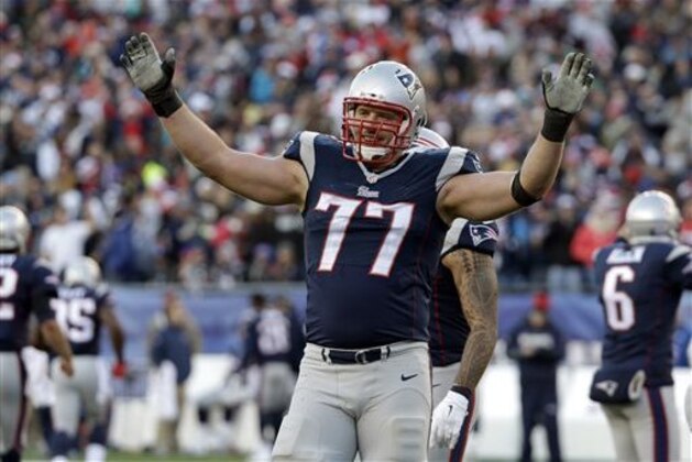 FILE - In this Dec. 14, 2014, file photo, New England Patriots tackle Nate Solder (77) reacts in the second half of an NFL football game against the Miami Dolphins in Foxborough, Mass.  A year ago, Patriots tackle Nate Solder underwent surgery for testicular cancer. He ended up playing every game in New England's championship season and now he's healthy as he participates in involuntary team workouts. (AP Photo/Steven Senne, File)