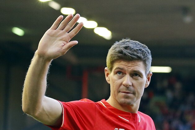 Liverpool's Steven Gerrard acknowledges the crowd after the English Premier League soccer match between Liverpool and Crystal Palace at Anfield Stadium, Liverpool, England, Saturday, May 16, 2015. Gerard played his final home match for Liverpool on Saturday at Anfield after over 700 appearances for the club, before he moves to MLS team LA Galaxy. (AP Photo/Jon Super)