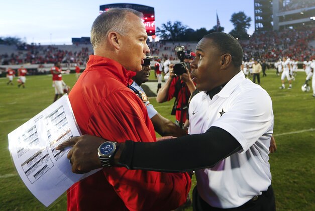 Georgia head coach Mark Richt, left, and Vanderbilt head coach Derek Mason talk after an NCAA college football game Saturday, Oct. 4, 2014, in Athens, Ga.. Georgia won 44-17. (AP Photo/John Bazemore)