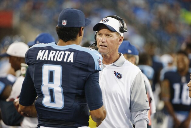 Tennessee Titans head coach Ken Whisenhunt talks with quarterback Marcus Mariota (8) in the first half of a preseason NFL football game against the Minnesota Vikings Thursday, Sept. 3, 2015, in Nashville, Tenn. (AP Photo/Weston Kenney)