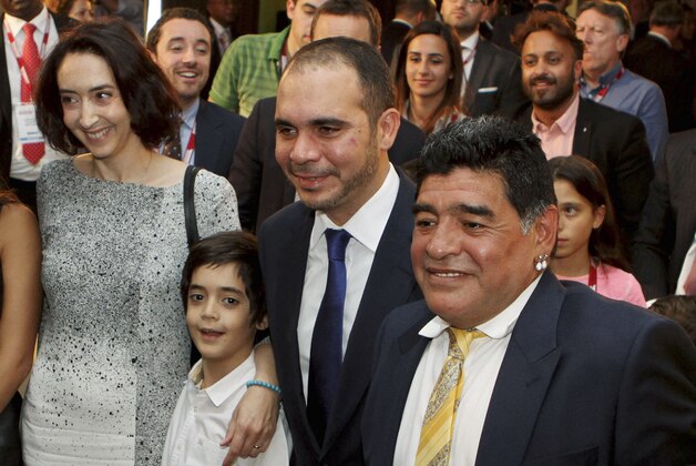 Argentine football legend Diego Maradona, from right, FIFA Vice-President and Jordan's Prince Ali bin al-Hussein, his son Abdullah and wife Princess Reem attend the second day of the Soccerex Asian Forum in Southern Shuneh, Jordan, Monday, May 4, 2015. (AP Photo/Raad Adayleh)