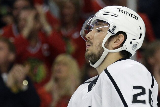 FILE - In this May 18, 2014, file photo, Los Angeles Kings' Slava Voynov reacts  during the second period in Game 1 of the Western Conference finals in the NHL hockey Stanley Cup playoffs in Chicago. Voynov has been charged with felony domestic violence. The Los Angeles County district attorney’s office announced the charge Thursday, Nov. 20, 2014. Voynov faces one felony count of corporal injury to a spouse with great bodily injury. The district attorney’s office says Voynov “caused his wife to suffer injuries to her eyebrow, cheek and neck” during an argument. (AP Photo/Nam Y. Huh, File)