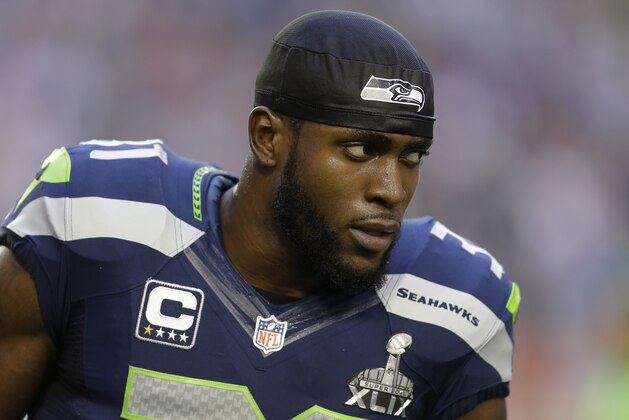 Seattle Seahawks strong safety Kam Chancellor (31) warms up before the NFL Super Bowl XLIX football game against the New England Patriots Sunday, Feb. 1, 2015, in Glendale, Ariz. (AP Photo/Ben Margot)