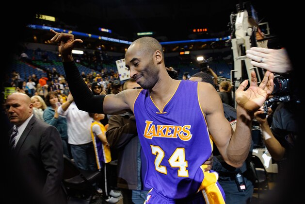 MINNEAPOLIS, MN - DECEMBER 14: Kobe Bryant #24 of the Los Angeles Lakers leaves the court after the game against the Minnesota Timberwolves on December 14, 2014 at Target Center in Minneapolis, Minnesota. Bryant passed Michael Jordan on the all-time scoring list with a free throw during the second quarter. The Lakers defeated the Timberwolves 100-94. NOTE TO USER: User expressly acknowledges and agrees that, by downloading and or using this Photograph, user is consenting to the terms and conditions of the Getty Images License Agreement. (Photo by Hannah Foslien/Getty Images)