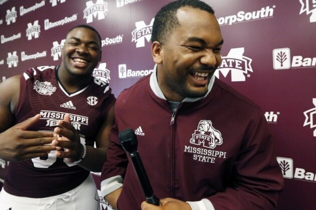 Mississippi State defensive lineman Chris Jones, left, jokes with offensive lineman Rufus Warren who acted as a Mississippi State defensive lineman Chris Jones, left, jokes with offensive lineman Rufus Warren who acted as a